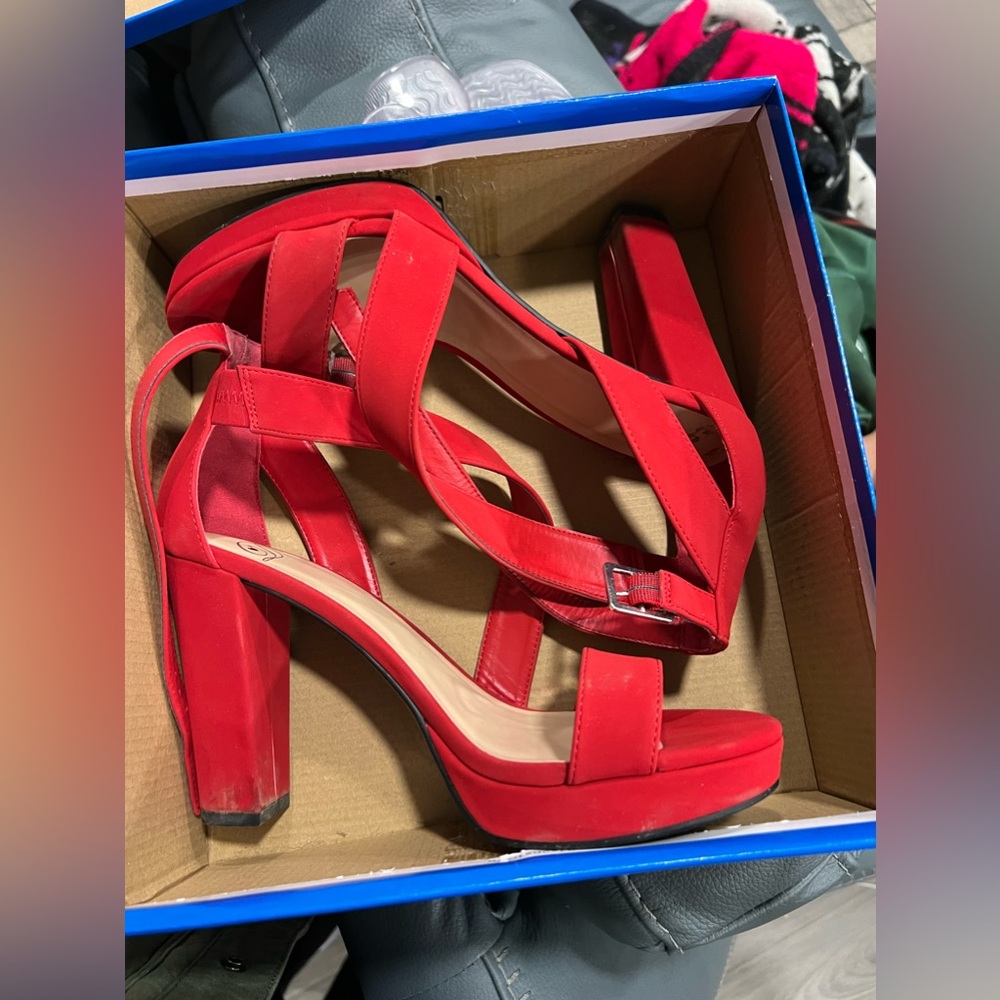 Size 8.5 delicious brand shoes, strappy red heels.
